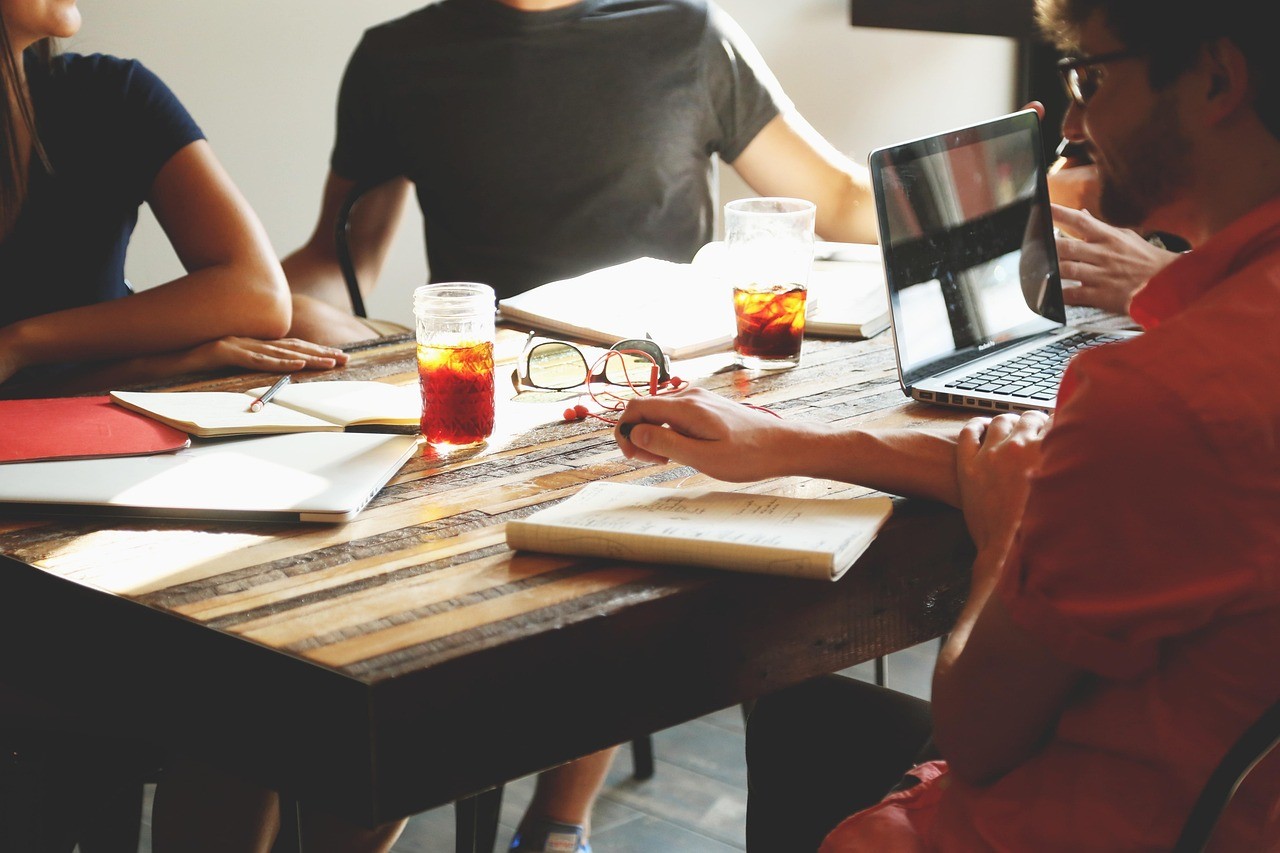 Marketing team reviewing campaign data together around an office table